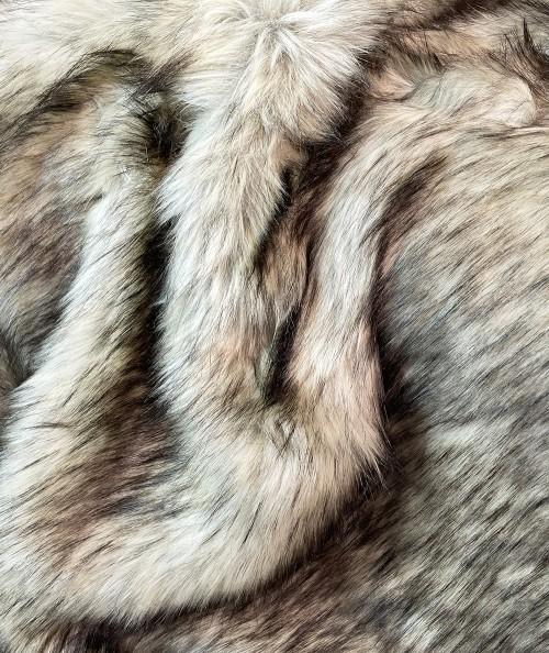 Close up image of long haired luxury brown faux fur fabric
