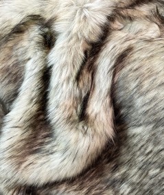 Close up image of long haired luxury brown faux fur fabric