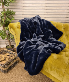 Dark blue faux fur sofa throws