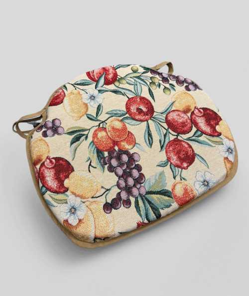 Spindle shaped chair pads with a multicoloured fruit design on a beige base