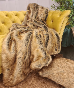 Luxury long-haired beige and brown faux fur sofa throw