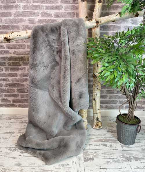 Taupe faux fur throw with ivory lining