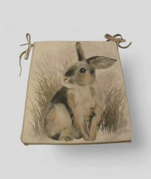 Duel design chair pads with a large rabbit and small ones